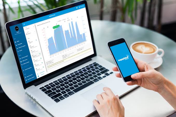 The Sapphire platform dashboard on a laptop with live cycle data, next to a phone showing the Sapphire app