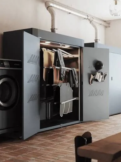 Ducted grey drying cabinets installed beside a commercial washer in a laundry room