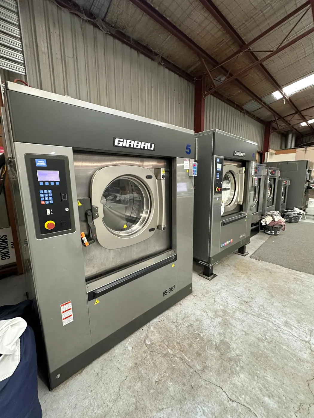 Girbau HS series washers installed in a commercial laundry