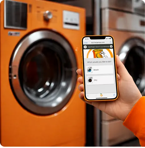 Customer using the Tangerpay app in front of a washer
