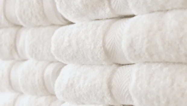 Clean fluffy white towels 620x350, How to Achieve High Quality Clean Linen Every Time
